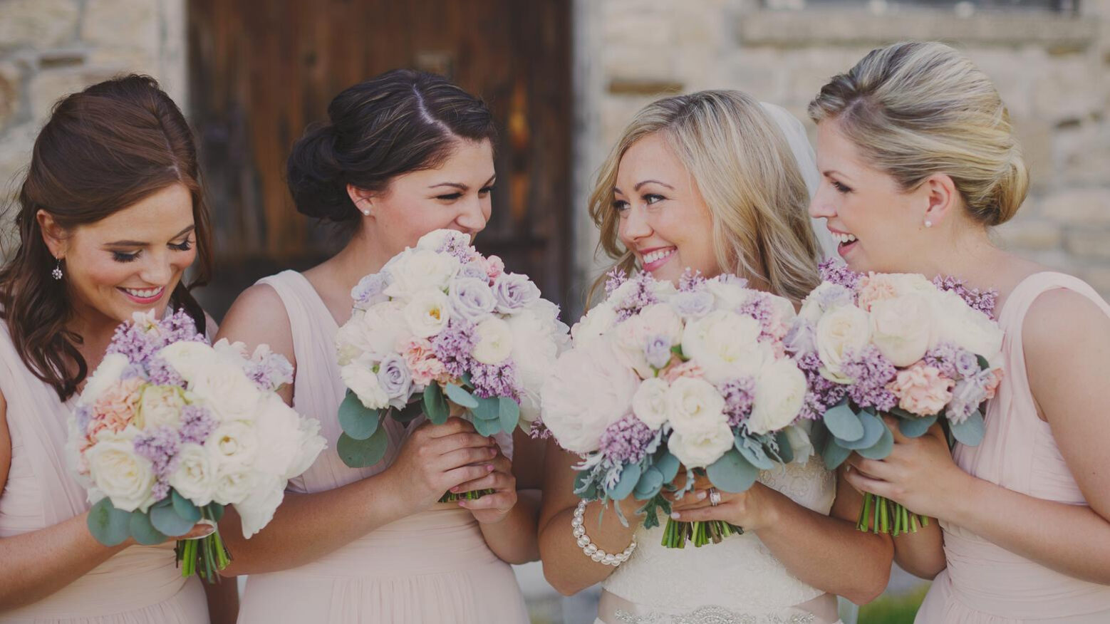 Bride and bridesmaids with personalized bouquets by Clipping’s Floral Designs from Vintage Hotels