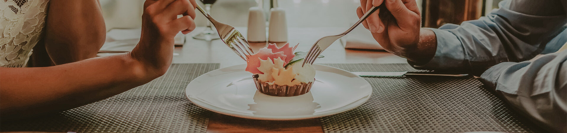 Two people sharing dessert at Headwaters Restaurant at Millcroft Inn & Spa in Caledon