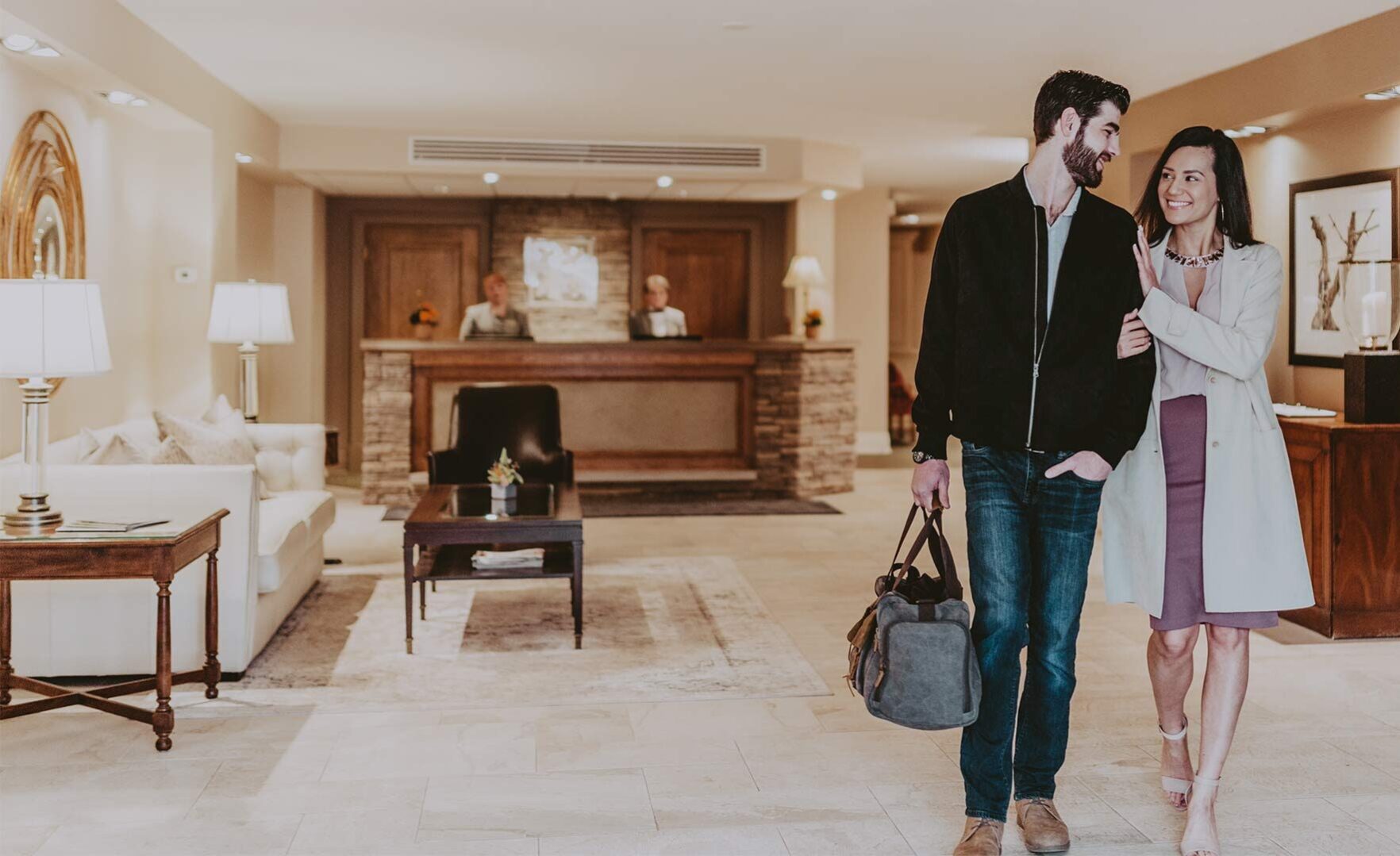 Couple checking out after their wine country getaway at Inn On The Twenty in Jordan Village