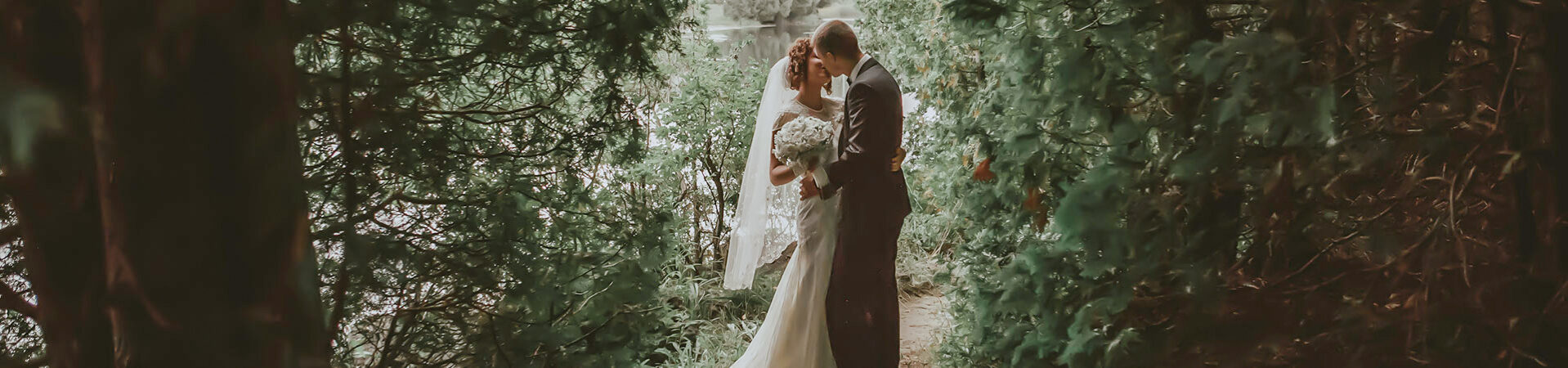 Couple sharing an intimate moment on their wedding at Millcroft Inn & Spa in Caledon