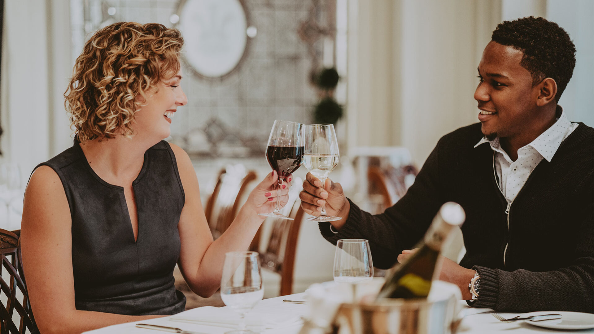 Couple toasting and dining in Noble Restaurant at the Prince of Wales Hotel in Niagara-on-the-Lake