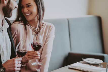 A couple toasting to their spring break getaway in Jordan Village.