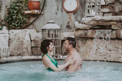 A couple enjoying the hot spring pool at 100 Fountain Spa in Niagara-on-the-Lake.