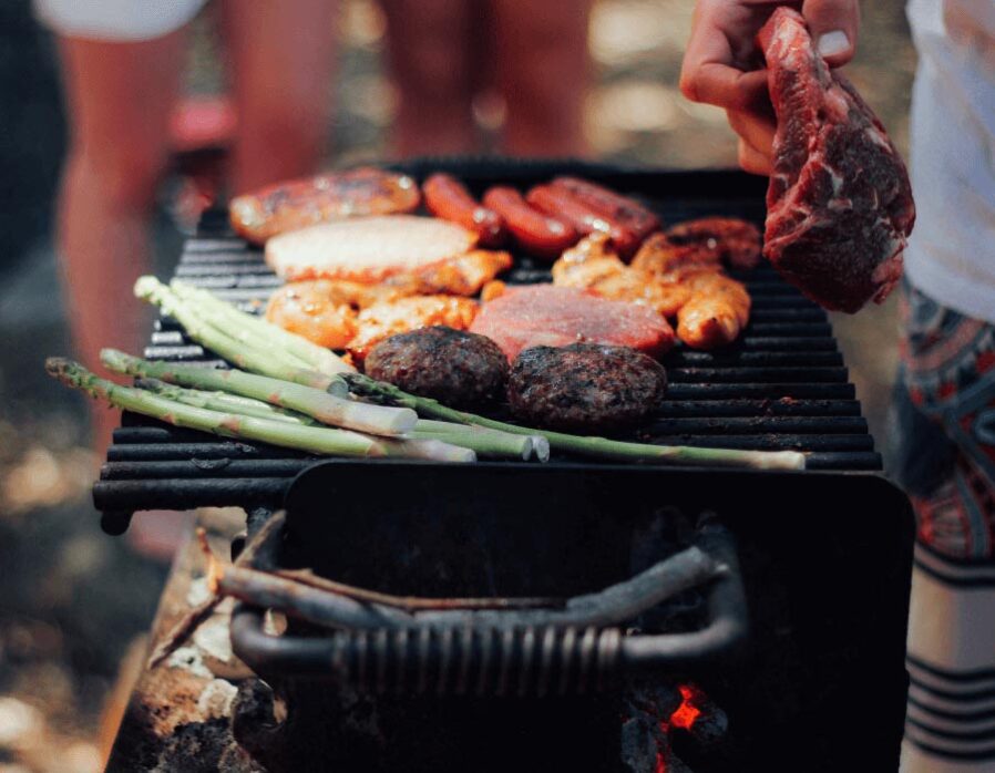 Man prepares summer bbq on the barbeque