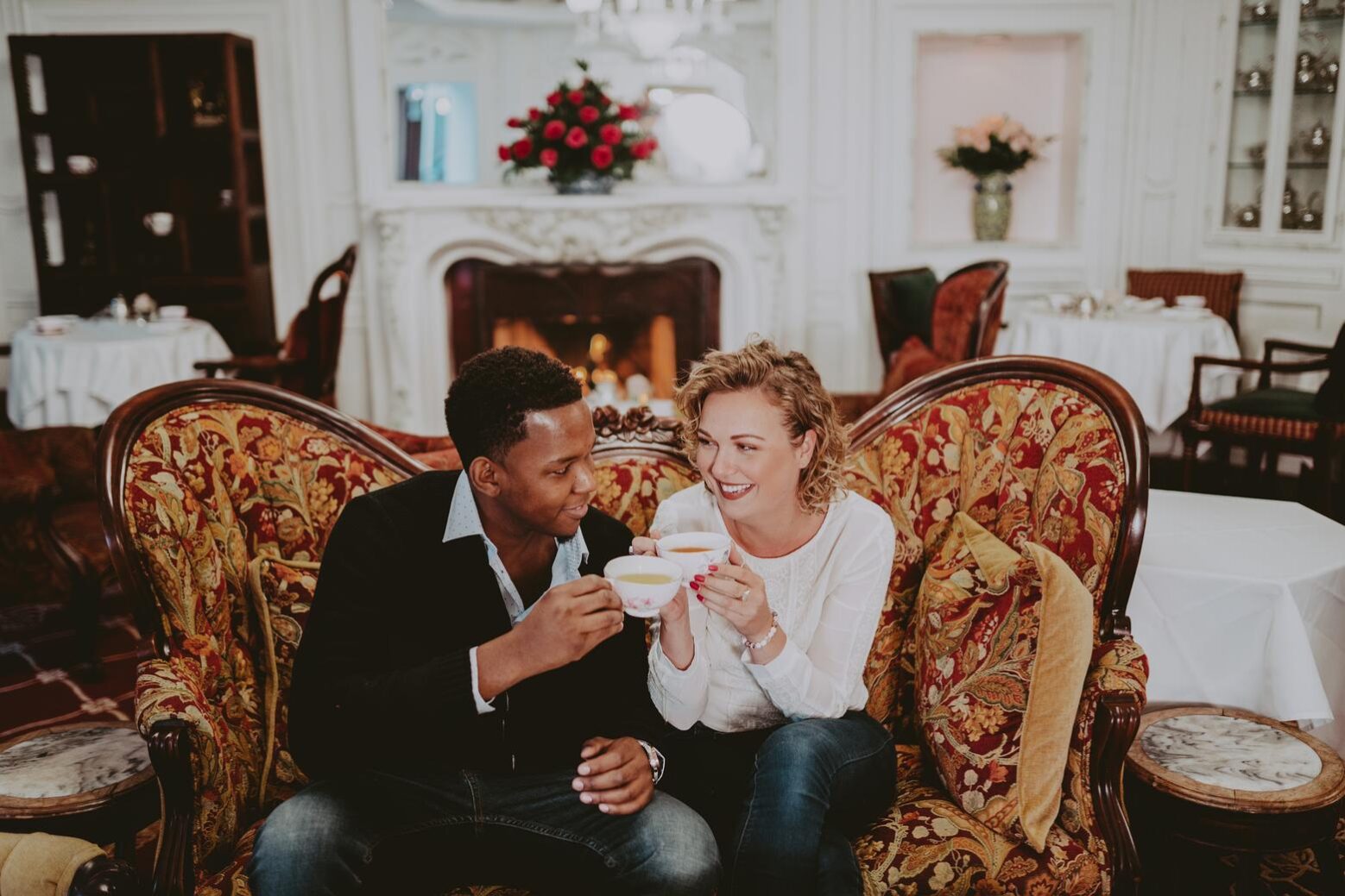 A couple toasting to a momentous occasion at The Drawing Room in Niagara-on-the-Lake.