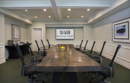 A meeting room with technology to accommodate hybrid attendees at Inn On The Twenty in Jordan Village.