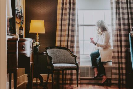 A woman relaxing in her room during a corporate retreat at the Queen’s Landing hotel in Niagara-on-the-Lake.