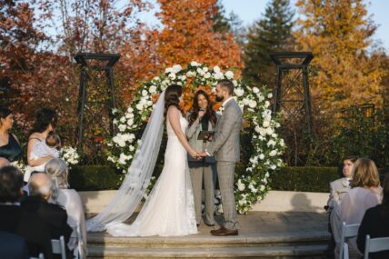 A couple tying the knot in the rose garden in Niagara-on-the-Lake.