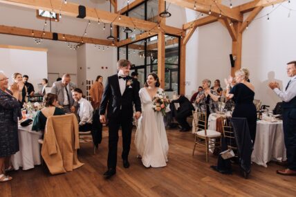 A couple celebrating their wedding reception at The Barn at The Gardens at Pillar and Post in Niagara-on-the-Lake.