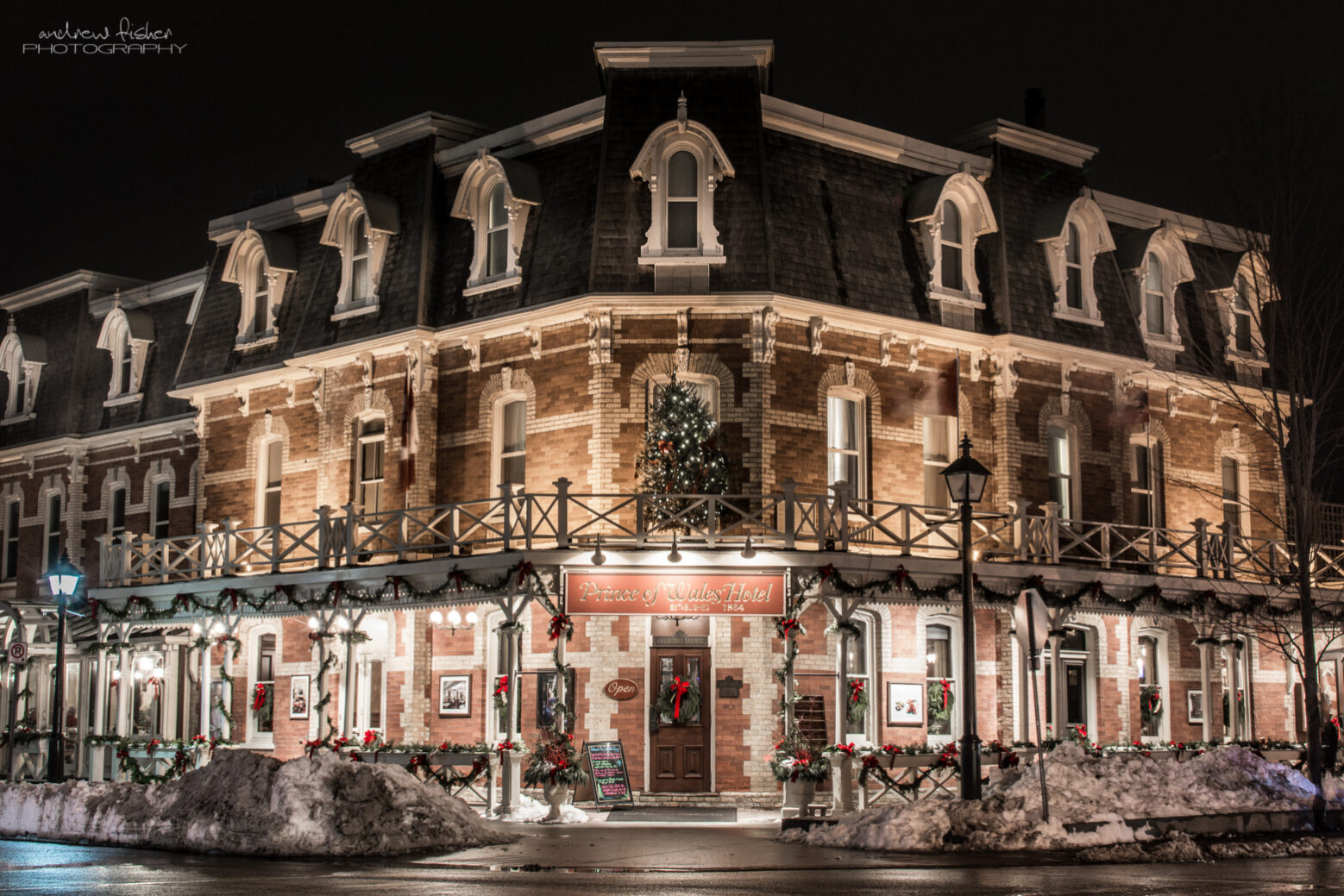 A photo of the Prince of Whales Hotel from the outside at night.