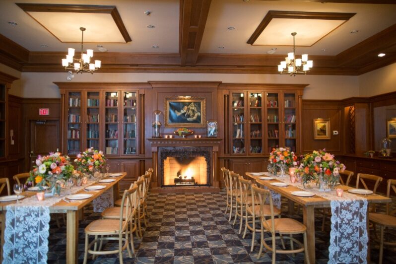 Tables set for a rehearsal dinner at in the Olde Library at Pillar and Post in Niagara on the Lake