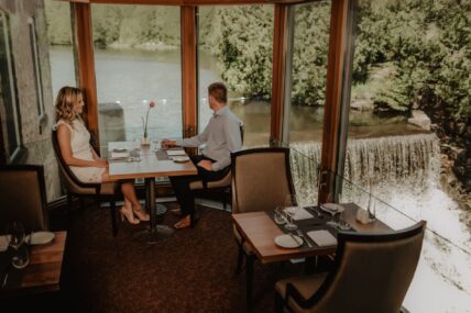 A couple enjoying a romantic dinner during a getaway to Ontario’s countryside