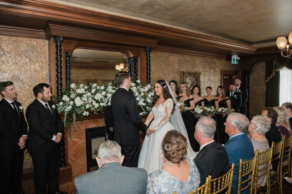 Bride and groom sharing their vows the in Hampton Court at Prince of Wales