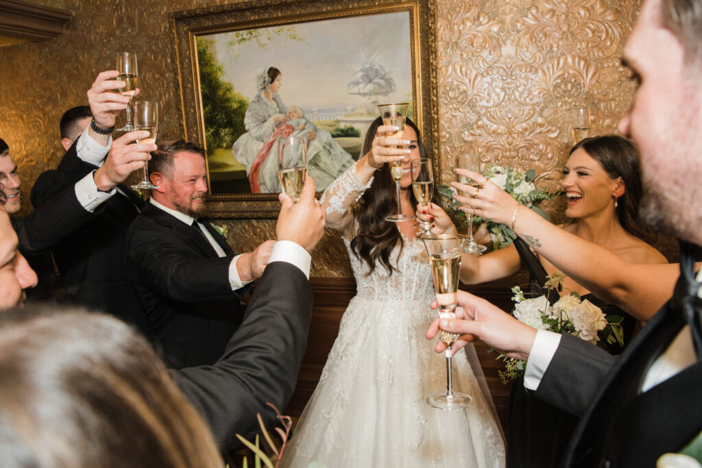 Wedding party toasting to the bride and groom