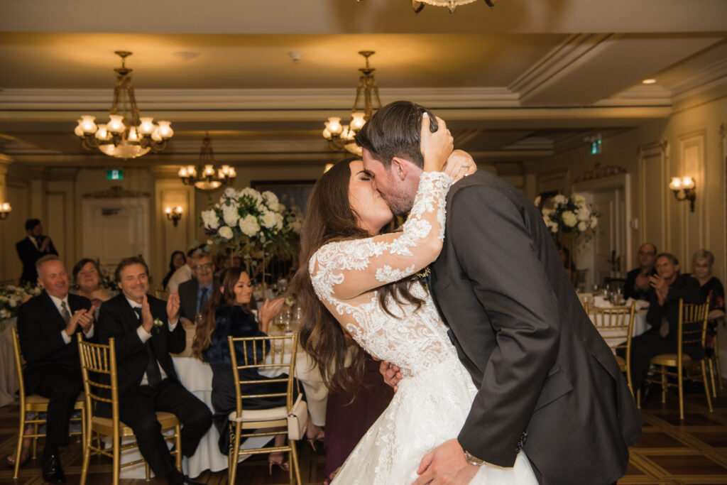 Bride and groom kissing during their first dance