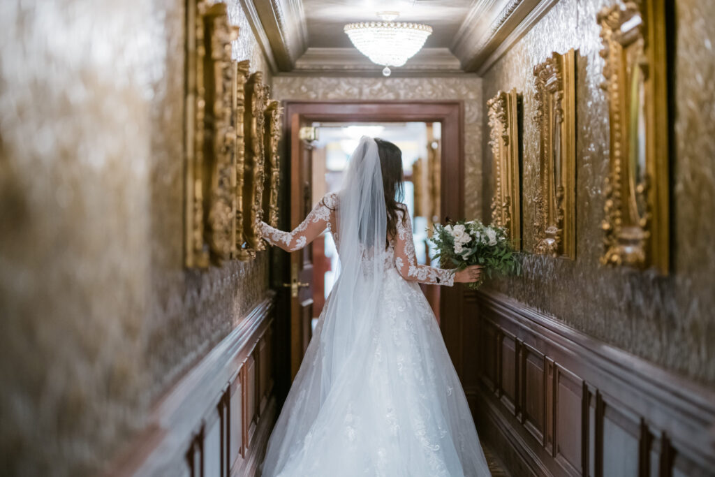 Bride walking in the Prince of Wales hallway