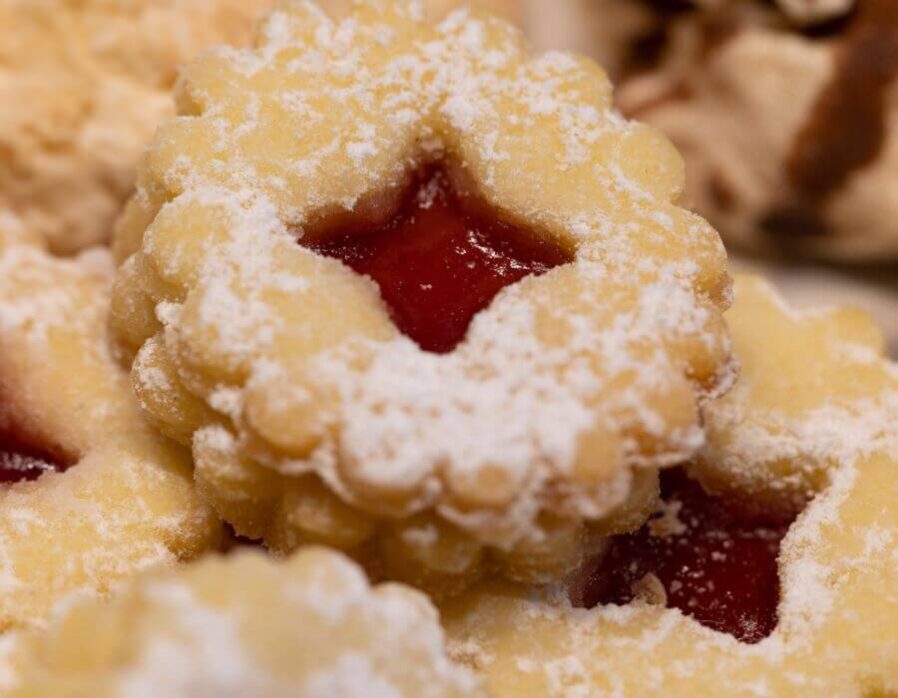 Strawberry Lavender Jam Shortcake Cookies with powdered sugar on it.