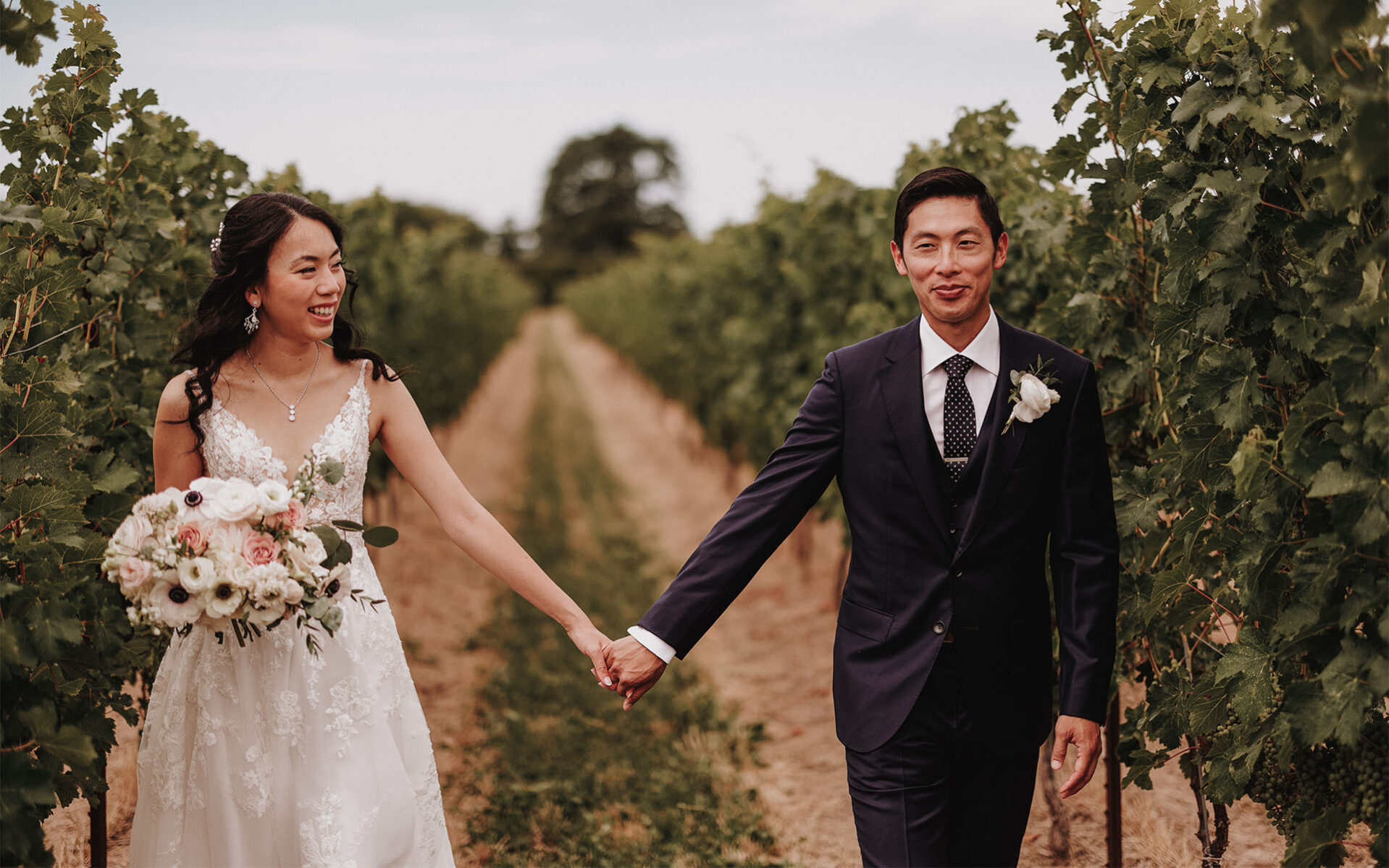 A married couple enjoying their wedding at Cave Spring Vineyard in Jordan, Ontario