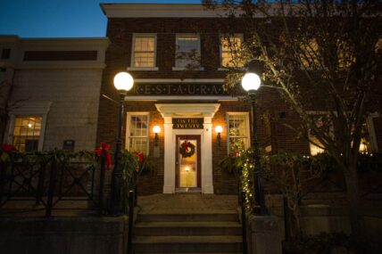 The outside of Inn On The Twenty Restaurant decorated for Christmas.