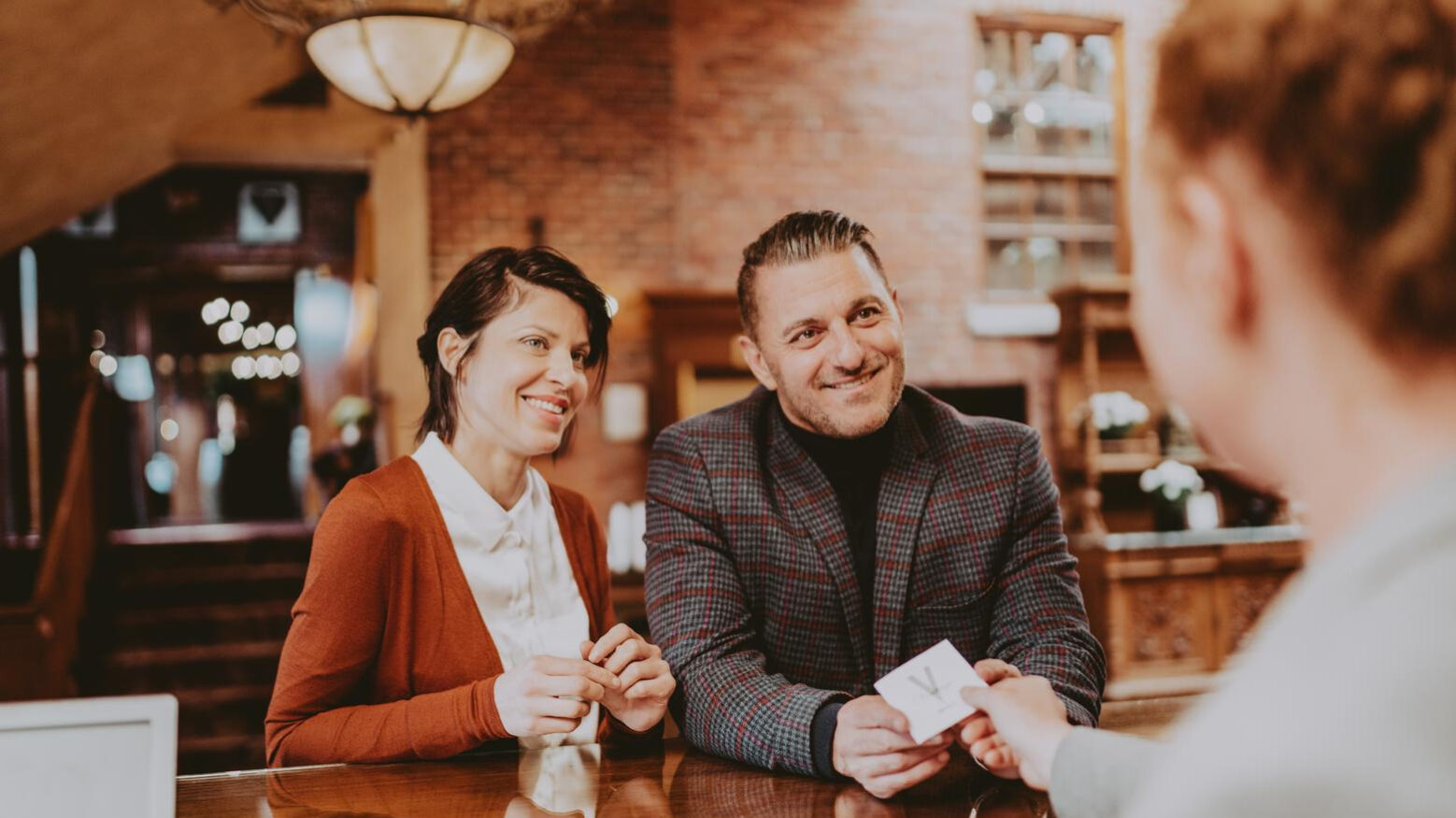 A couple checking into their romantic weekend getaway in Ontario.