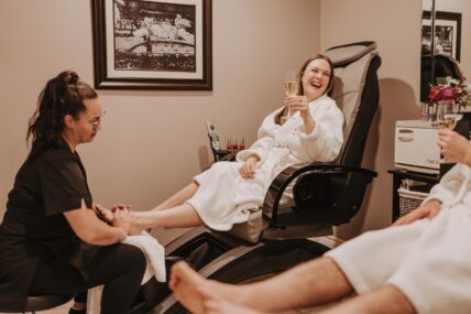 A woman enjoying her birthday with a pedicure at Spa On The Twenty in Jordan Village.