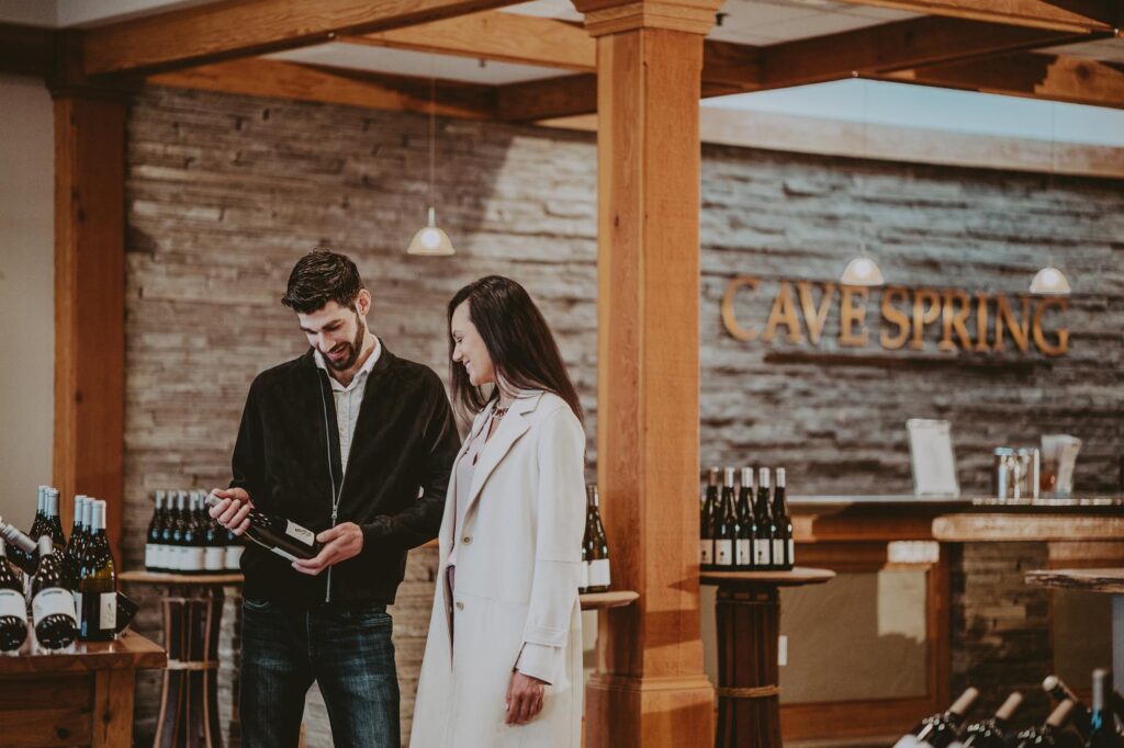 A couple enjoying the Signature Jordan Wine Tour at Cave Spring Vineyard.