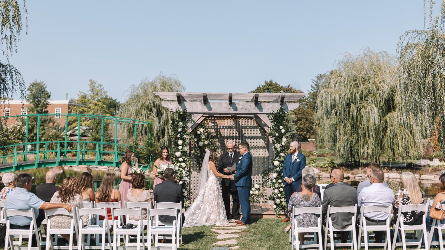 A couple getting married in The Gardens at Pillar and Post in Niagara-on-the-Lake.