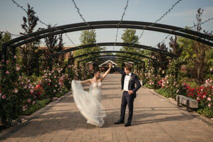 Newlyweds dancing in The Gardens at Pillar and Post in Niagara-on-the-Lake.