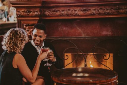 A couple toasting during a romantic dinner at Noble Restaurant in Niagara-on-the-Lake.