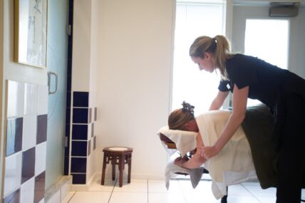 A woman receiving a massage at Millcroft Spa during an executive retreat in Caledon, Ontario.