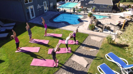 A group of girls doing yoga outside of Millcroft Inn & Spa in Caledon, Ontario.