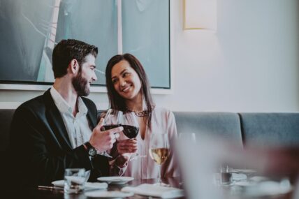 A couple enjoying an intimate fine-dining experience at Inn On The Twenty Restaurant in Jordan Village.